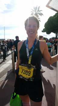 Lorna with race number and medal on Cannes Croisette